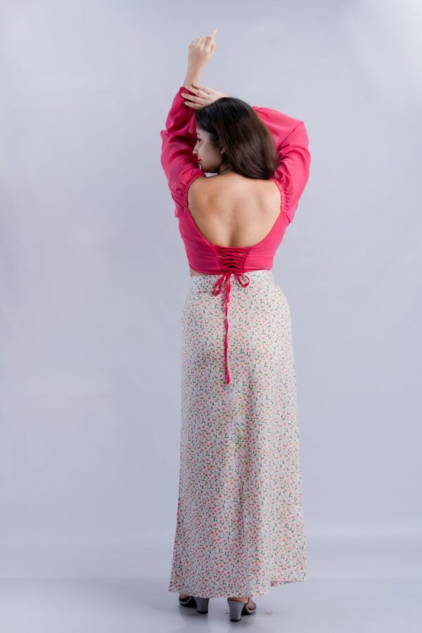 Crossing pink crop top and flower printed skirt