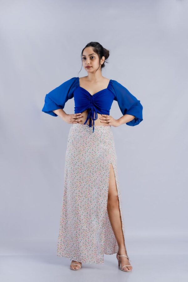 Crossing dark blue crop top and flower printed skirt