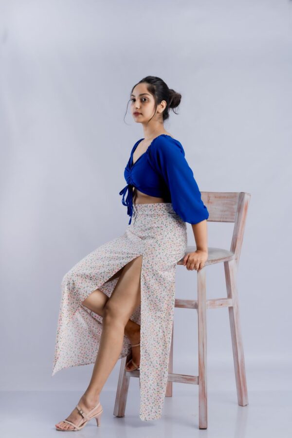 Crossing dark blue crop top and flower printed skirt