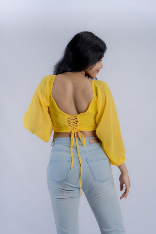 Crossing yellow crop top